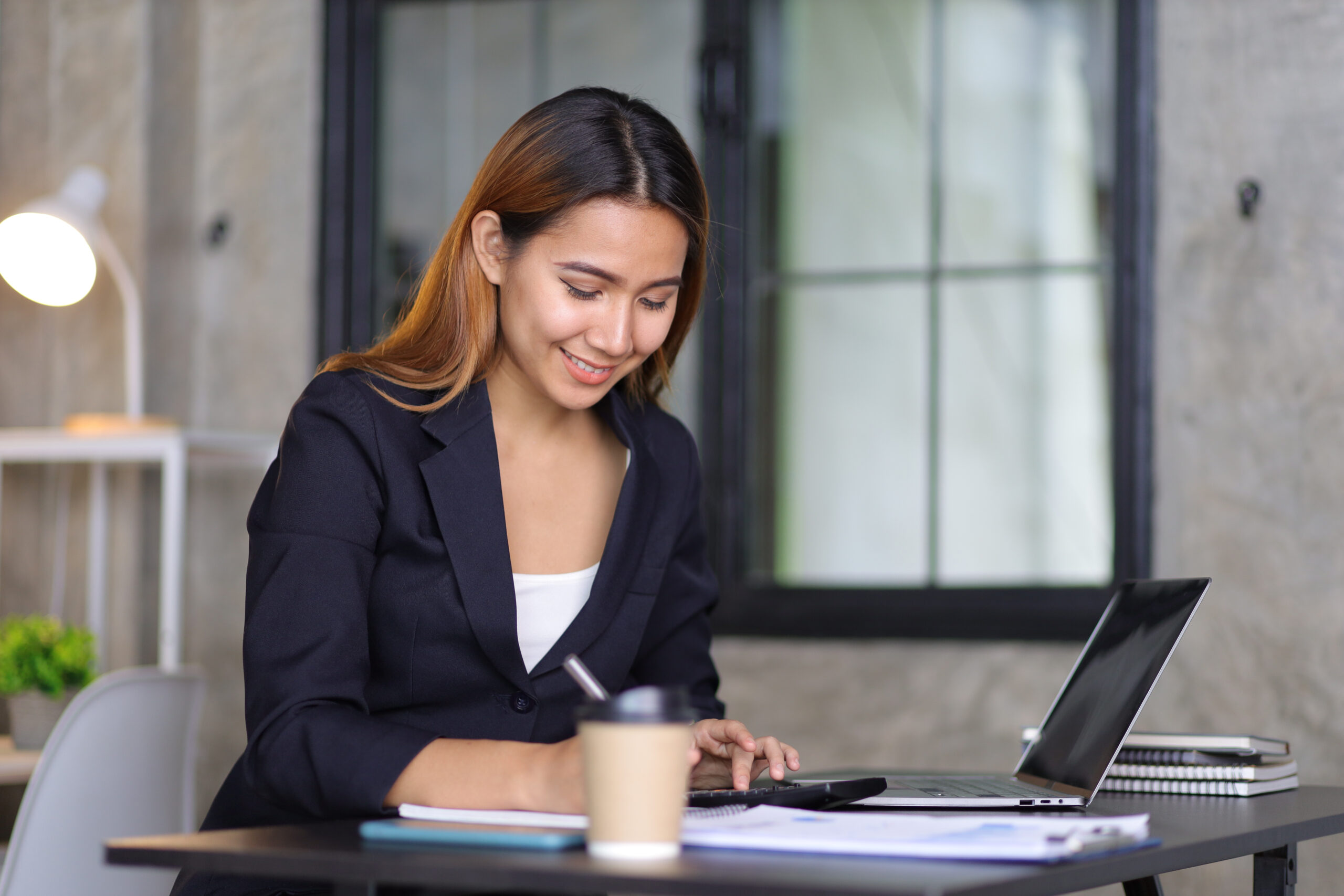 Accounting professional working at a laptop